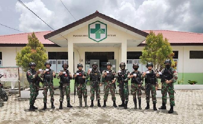 Prajurit TNI Satgas Pamtas Yonif 131/Brs Laksanakan Vaksinasi Covid-19